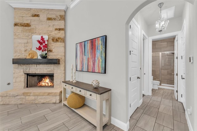 110 Magona Trl, Georgetown, TX 78628 - hall with arched walkways, baseboards, and an inviting chandelier
