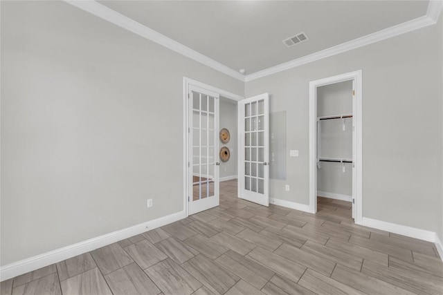 110 Magona Trl, Georgetown, TX 78628 - empty room featuring crown molding, baseboards, french doors, and visible vents