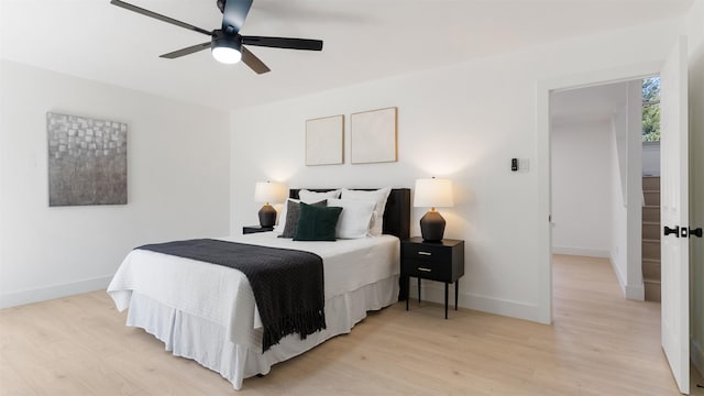 bedroom with ceiling fan and light wood-type flooring