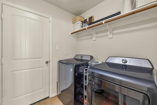 laundry room with washing machine and dryer