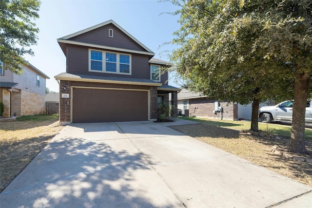 104 Bufflehead Ln, Leander, TX 78641 - view of front of property with an attached garage, driveway, and brick siding