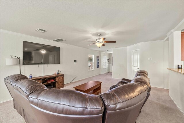 104 Bufflehead Ln, Leander, TX 78641 - living room featuring light colored carpet, ceiling fan, ornamental molding, and baseboards