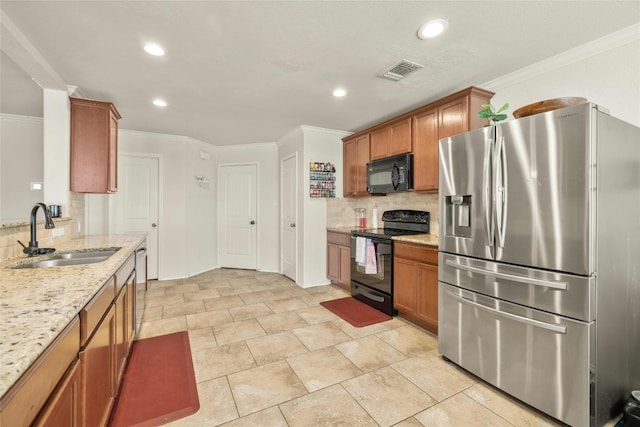 kitchen featuring ornamental molding, sink, black appliances, light stone counters, and tasteful backsplash