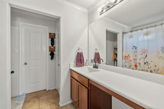 bathroom with vanity, ornamental molding, and tile patterned floors