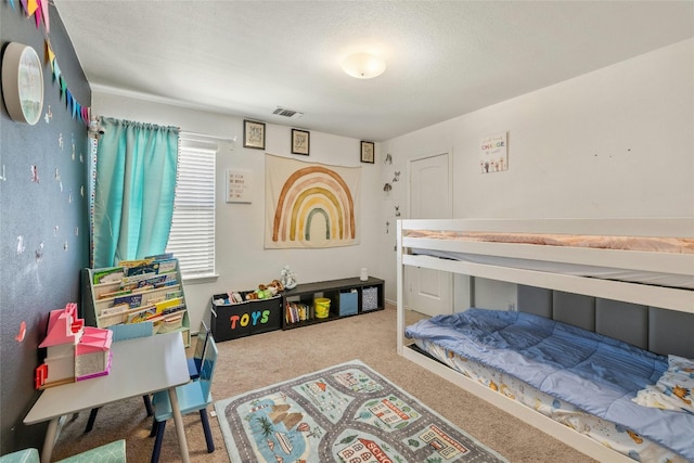 104 Bufflehead Ln, Leander, TX 78641 - carpeted bedroom with a textured ceiling