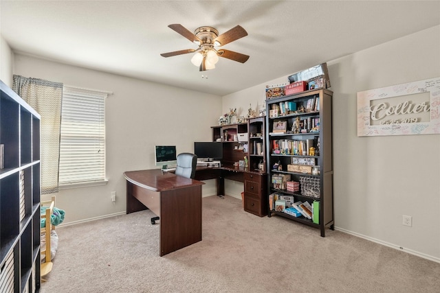 office with light colored carpet and ceiling fan