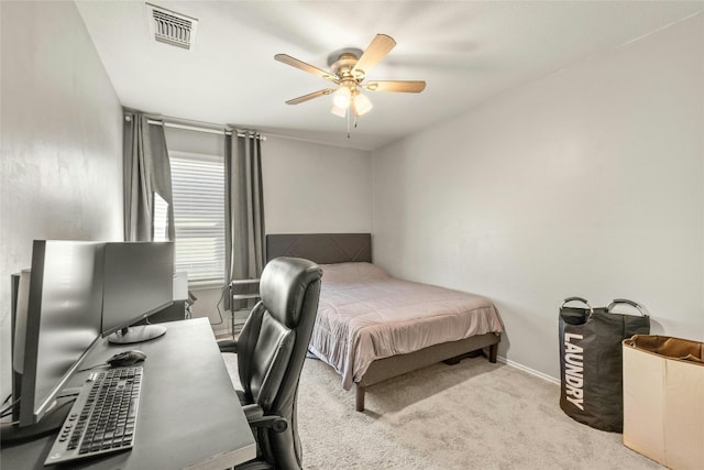 bedroom with light carpet and ceiling fan