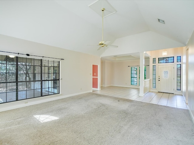 unfurnished living room with ceiling fan, lofted ceiling, and light colored carpet