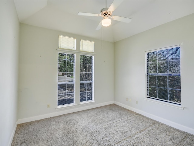 spare room with carpet and ceiling fan