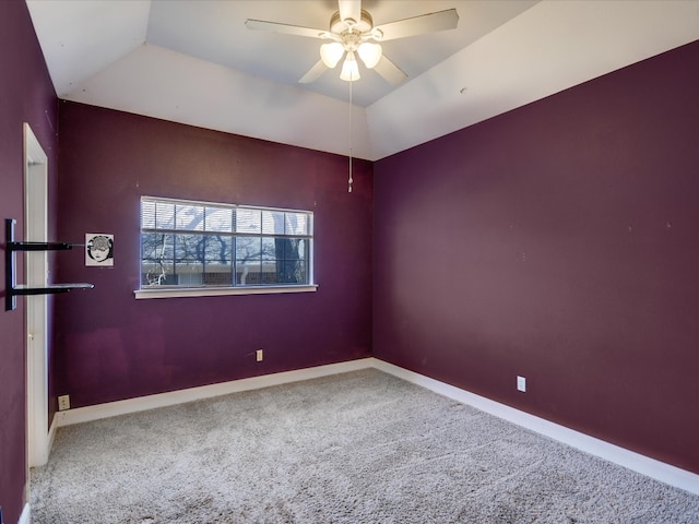 carpeted empty room with lofted ceiling and ceiling fan