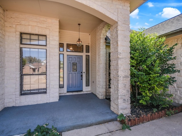 property entrance featuring covered porch