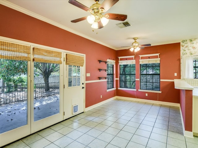 entryway featuring crown molding, light tile patterned floors, and ceiling fan