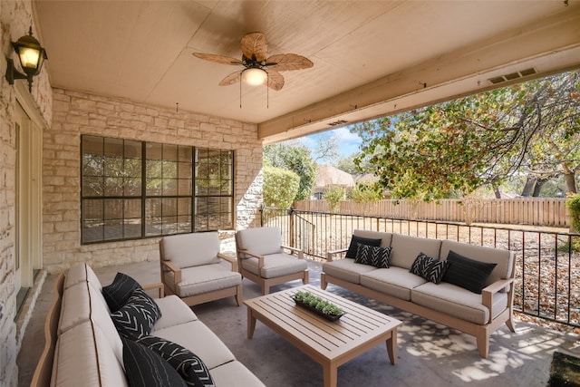 view of patio with outdoor lounge area and ceiling fan