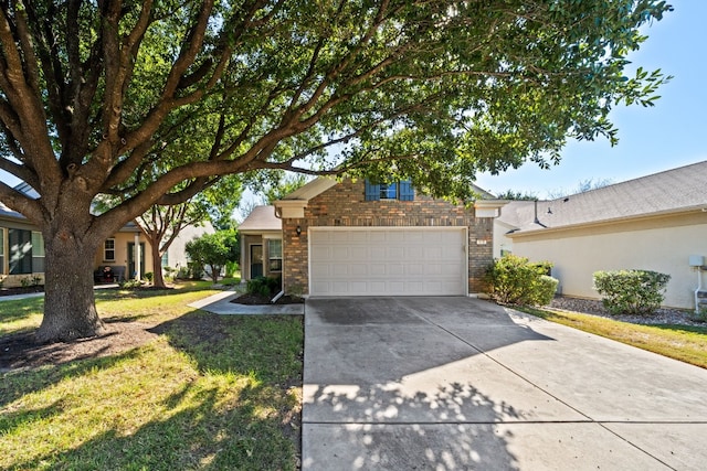 view of front of property with a front yard and a garage