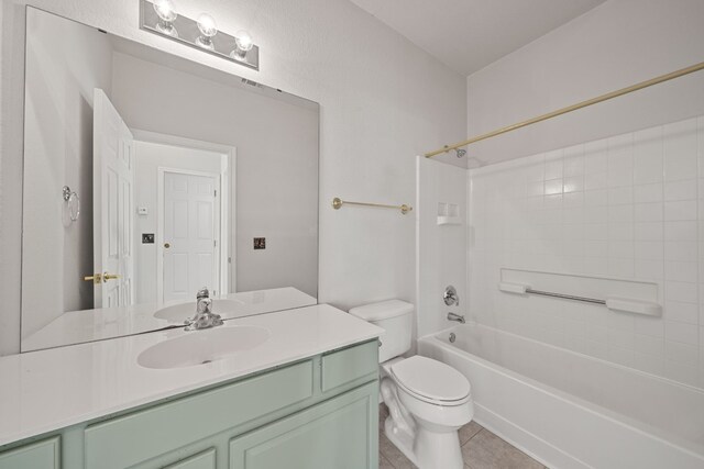 full bathroom featuring toilet, tile patterned flooring, vanity, and tub / shower combination