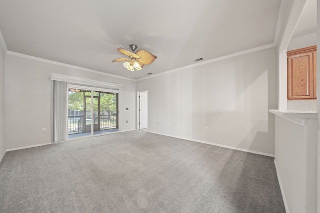 carpeted empty room featuring ceiling fan and crown molding