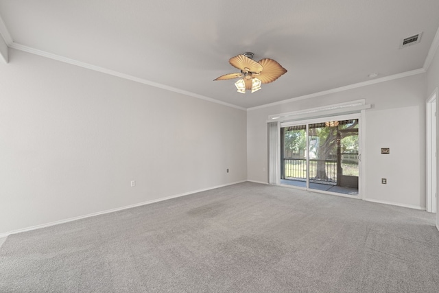 spare room featuring carpet flooring, ceiling fan, and crown molding