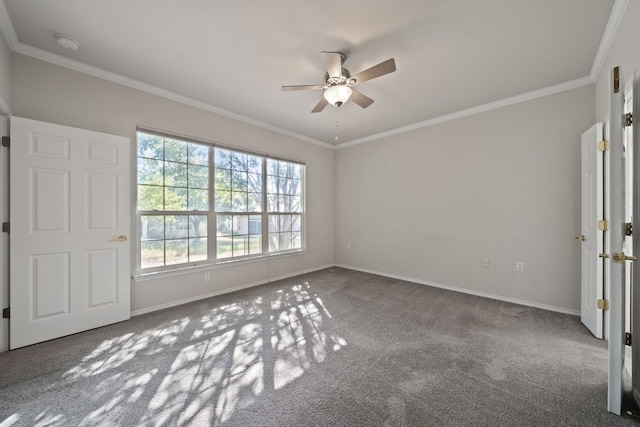 carpeted empty room with ceiling fan and ornamental molding