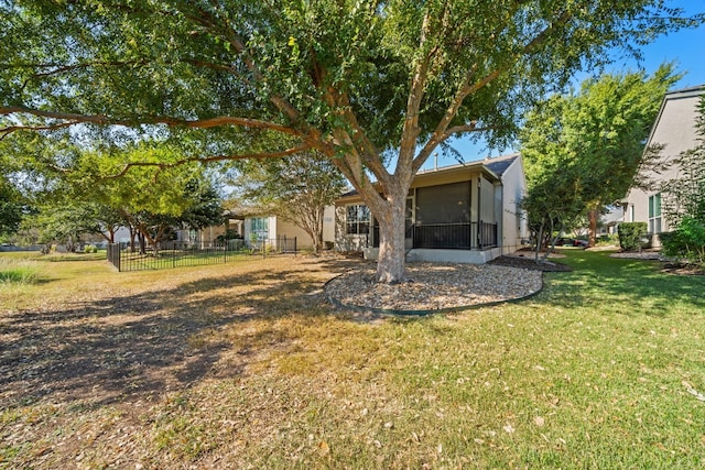 view of yard with a sunroom