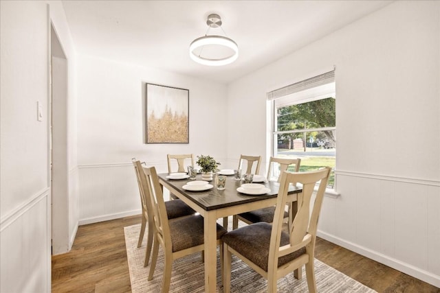 dining space featuring wood-type flooring