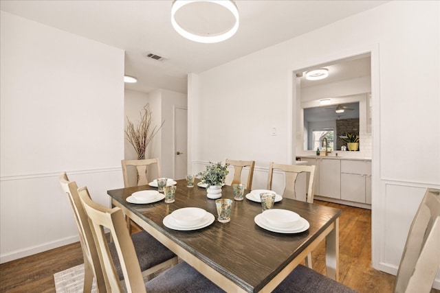 dining room with dark wood-type flooring