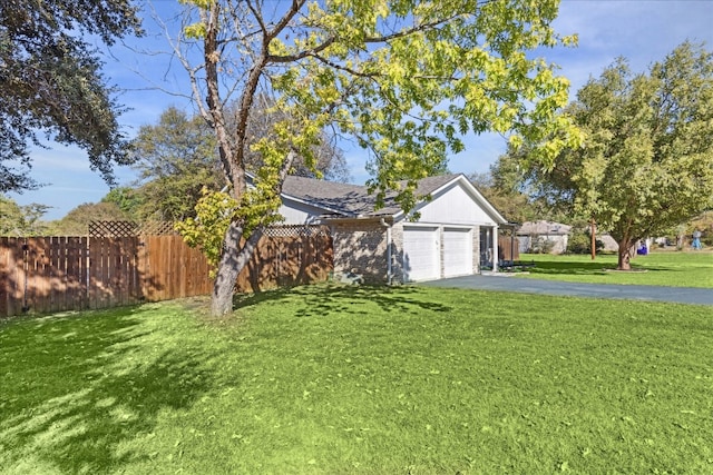 view of front of property with a garage and a front yard