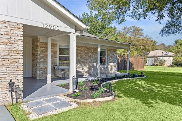 doorway to property featuring a yard