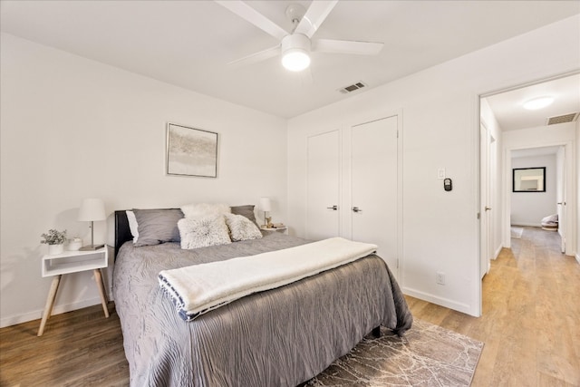 bedroom featuring wood-type flooring and ceiling fan