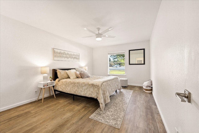 bedroom featuring wood-type flooring and ceiling fan