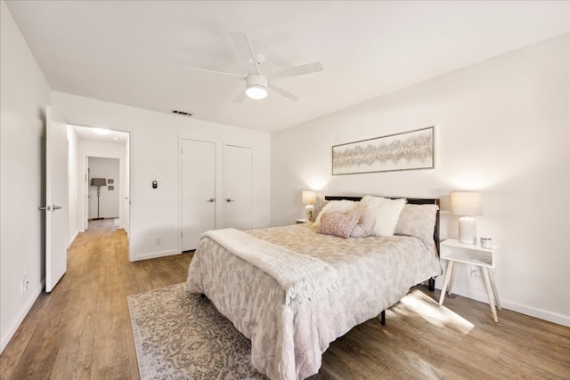 bedroom featuring hardwood / wood-style floors and ceiling fan