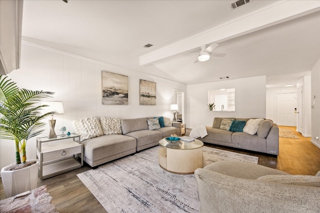 living room with vaulted ceiling with beams, hardwood / wood-style floors, and ceiling fan