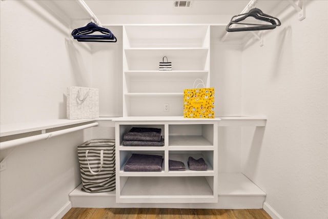 spacious closet with wood-type flooring