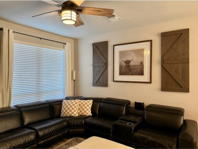 living room featuring ceiling fan