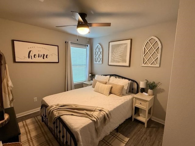 bedroom featuring ceiling fan and dark hardwood / wood-style floors