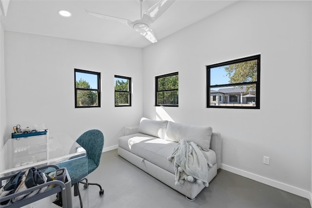 office with concrete flooring, a healthy amount of sunlight, and ceiling fan