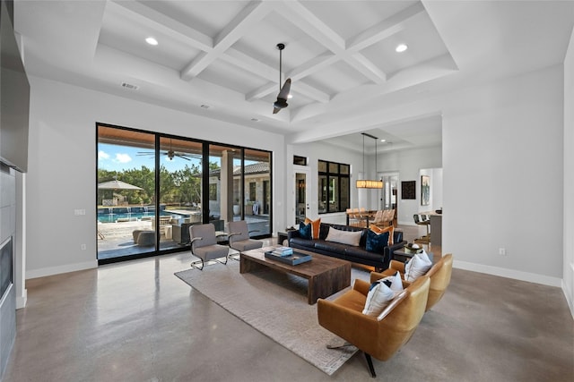 living room featuring beamed ceiling, coffered ceiling, concrete floors, and ceiling fan