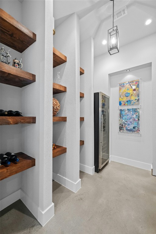 interior space featuring wine cooler and built in shelves