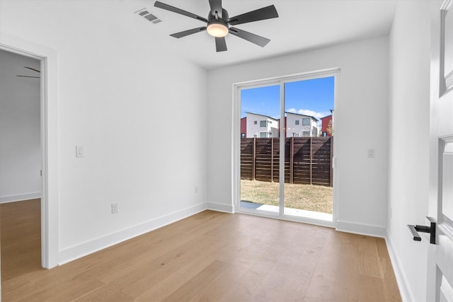 unfurnished room featuring light hardwood / wood-style flooring and ceiling fan