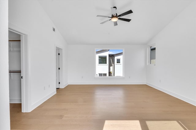 unfurnished living room featuring light hardwood / wood-style floors, lofted ceiling, and ceiling fan