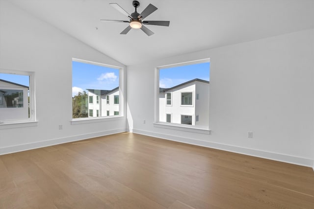 unfurnished room featuring ceiling fan, vaulted ceiling, and hardwood / wood-style floors