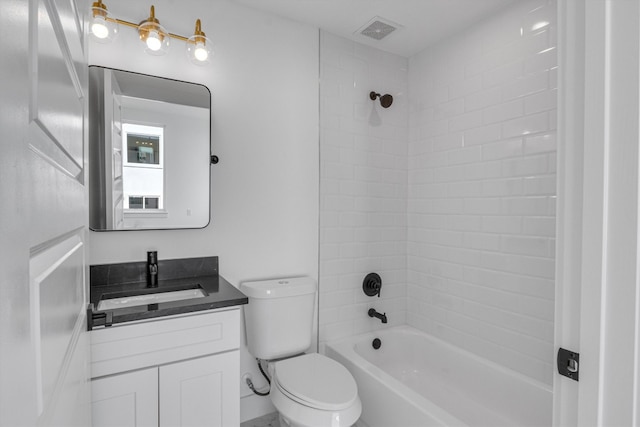 full bathroom with vanity, toilet, and tiled shower / bath