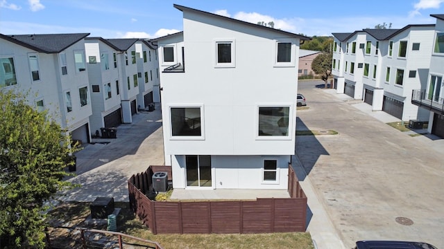 exterior space featuring central AC and a garage