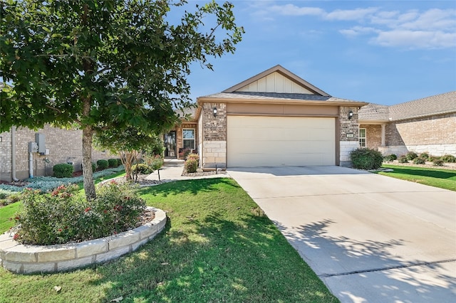 view of front of house with a front yard and a garage