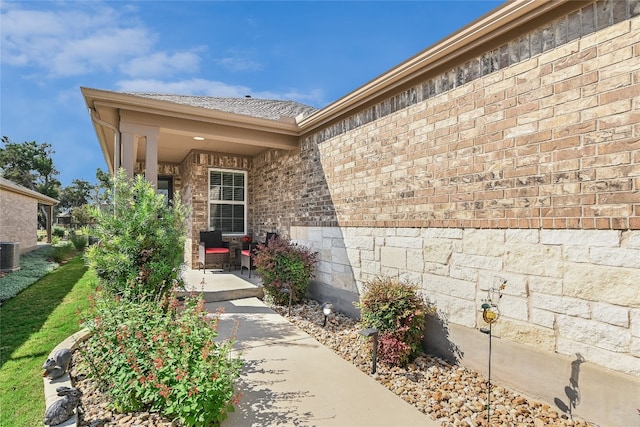 entrance to property featuring central AC