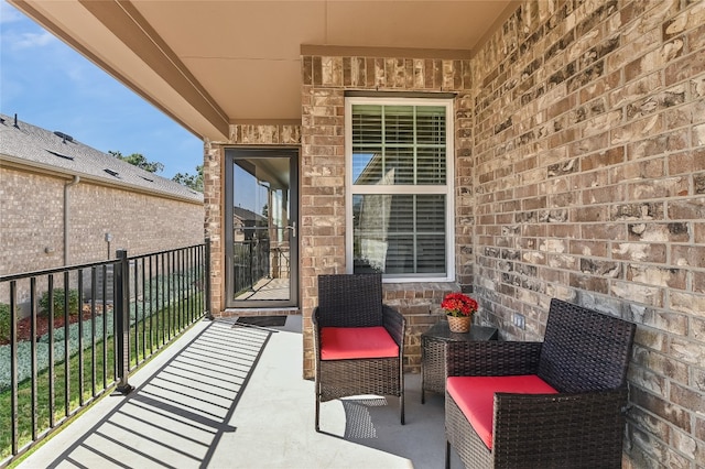 view of patio with a balcony