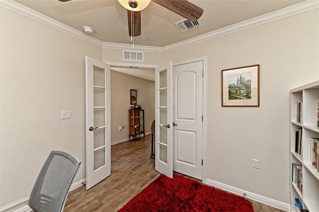 office featuring french doors, crown molding, and wood-type flooring