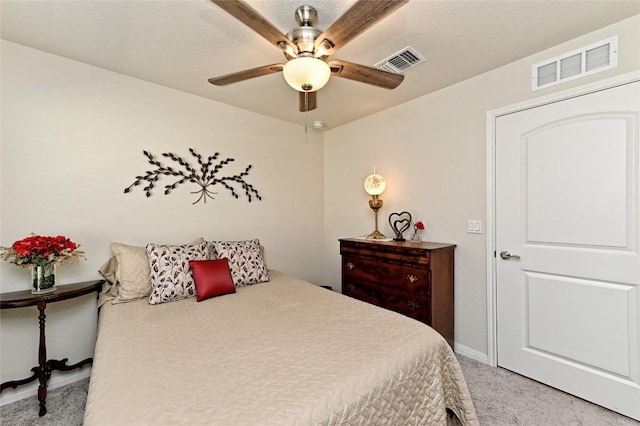 carpeted bedroom with ceiling fan