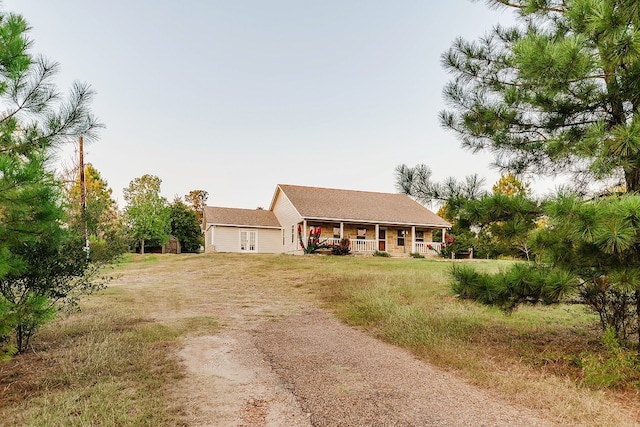 ranch-style house featuring covered porch