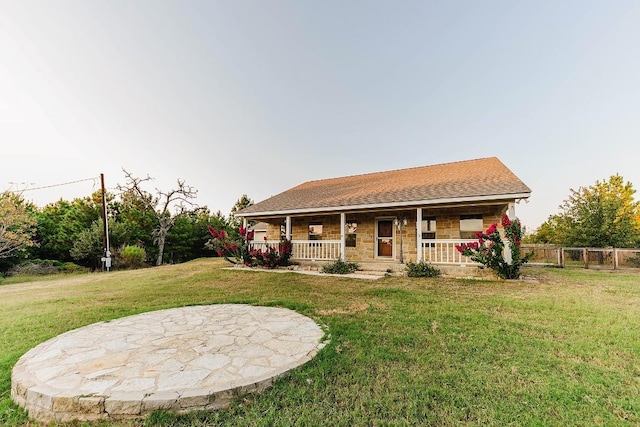 view of front facade with a front yard and a porch