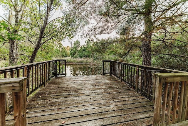 wooden deck with a water view